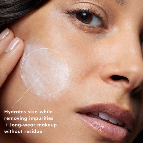 Close-up of a woman's face with skincare product application, text about product benefits.